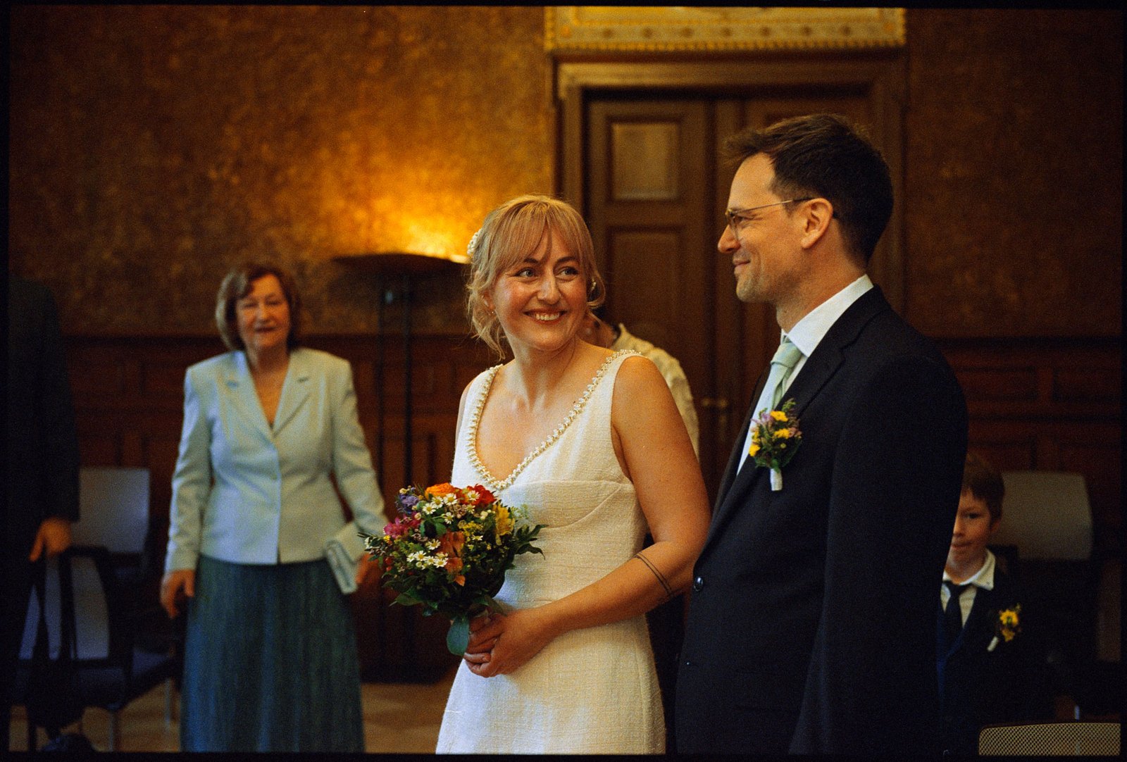The couple at the ceremony indoors