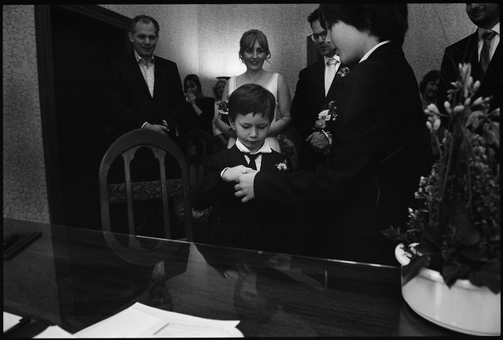 A child carrying the rings, in black and white