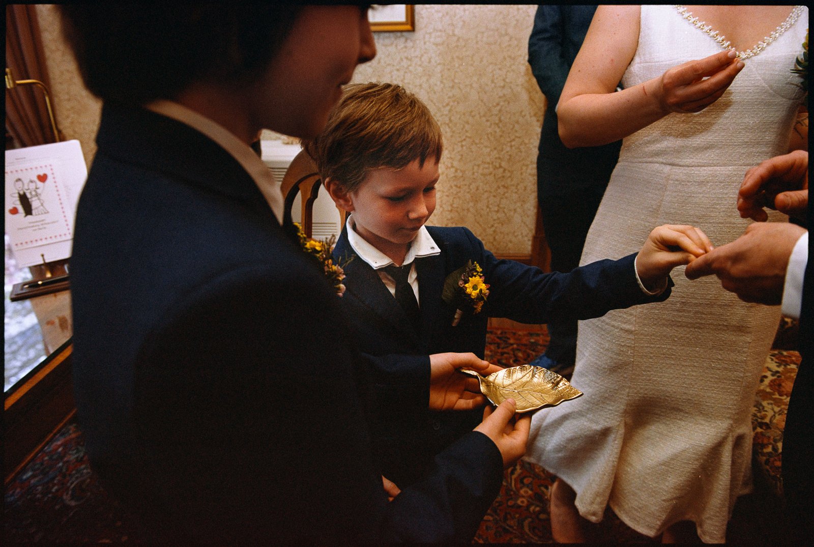 A child presenting the wedding rings