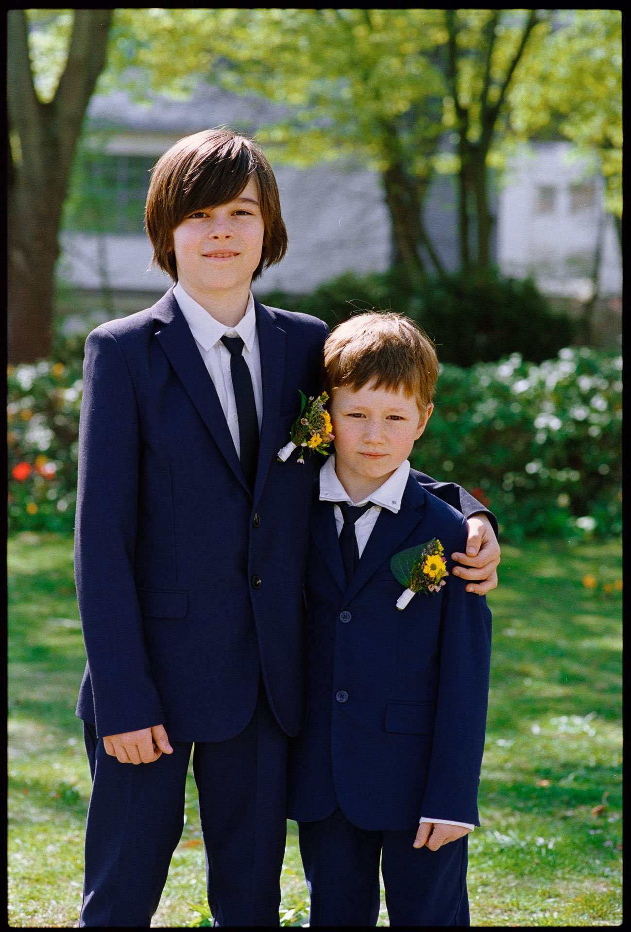 Two boys in suits in the garden