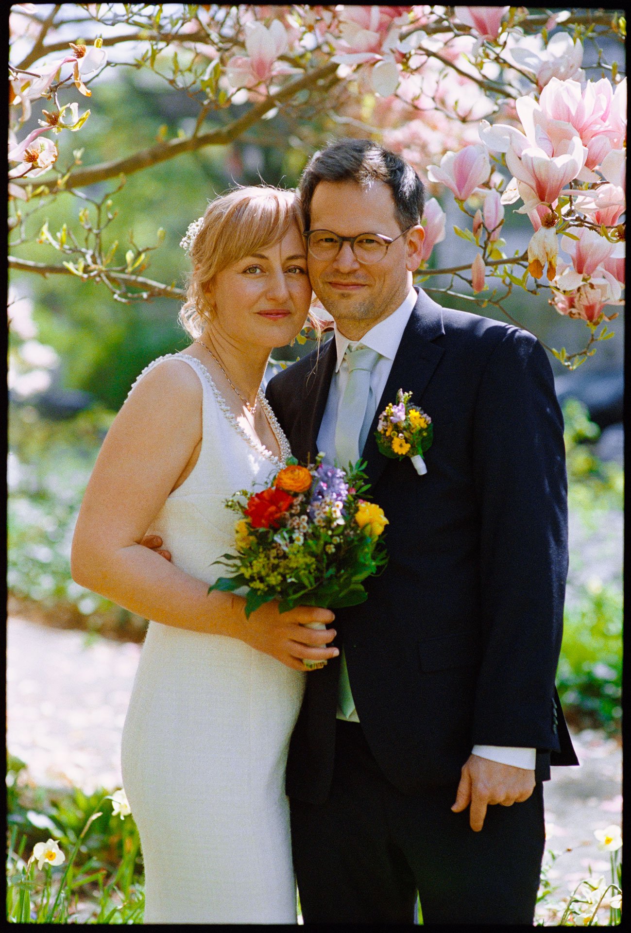 The couple among magnolia blossom