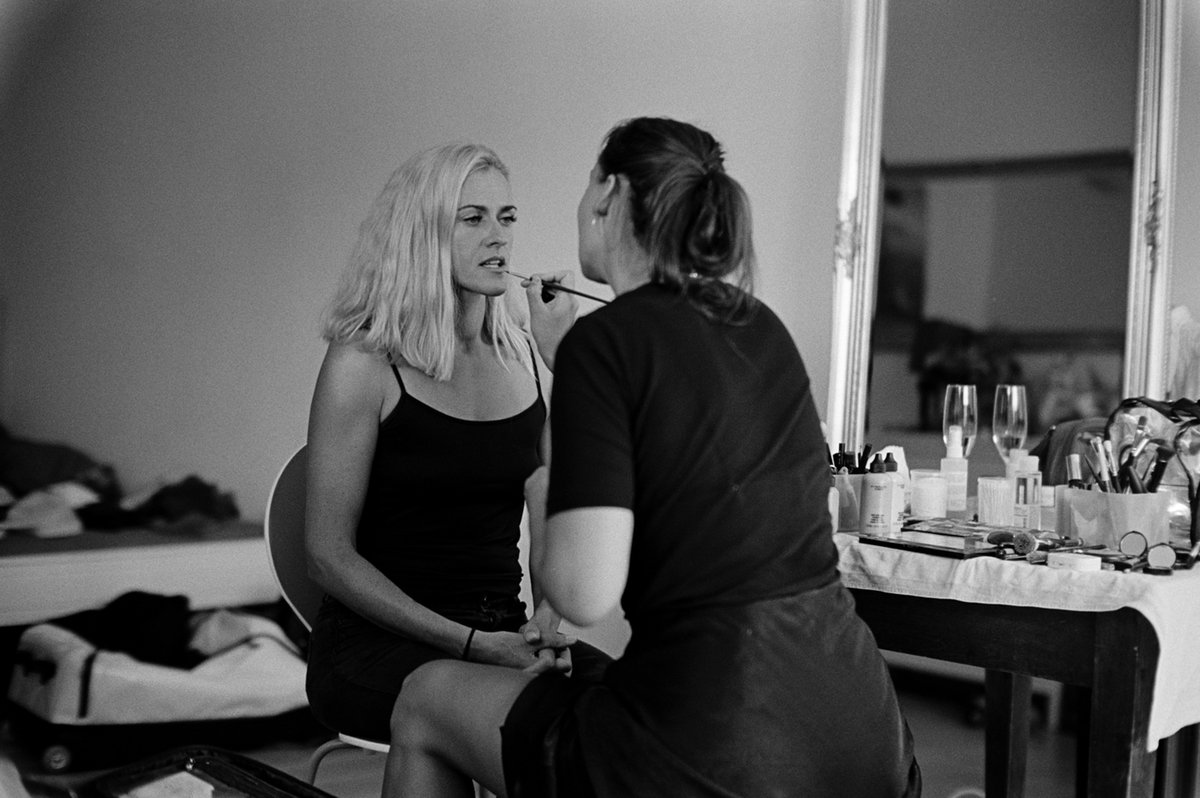 The bride with her make-up artist before the ceremony, black and white