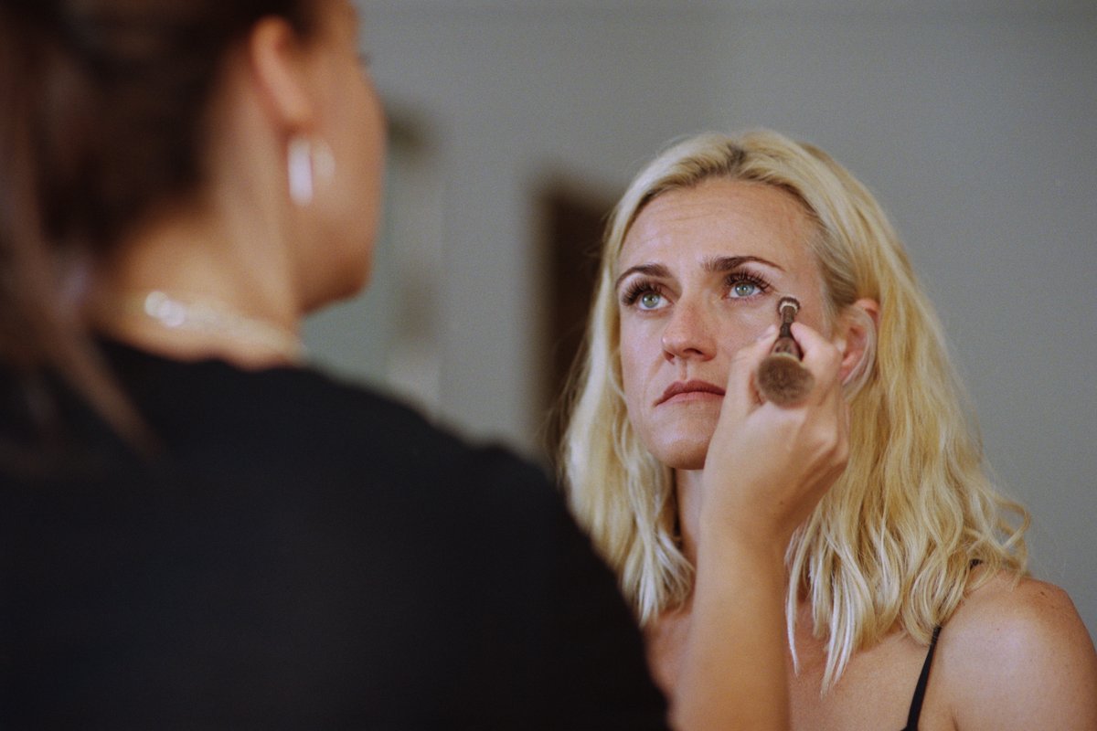 A quiet, emotional moment as the bride gets ready, black and white