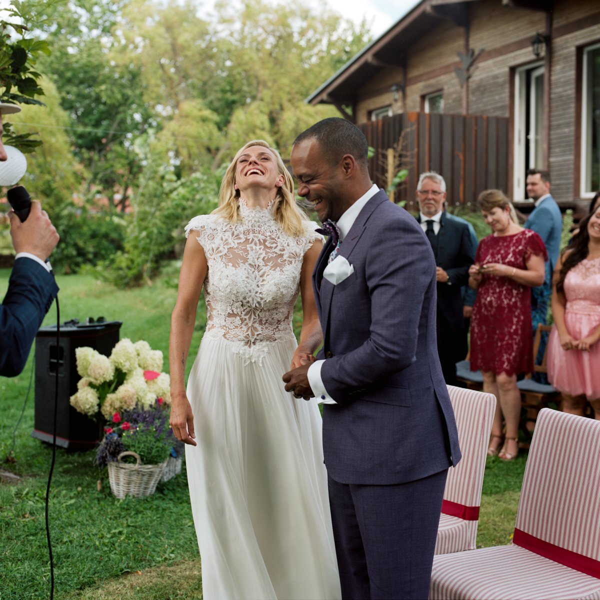 The bride and groom standing together during the garden ceremony