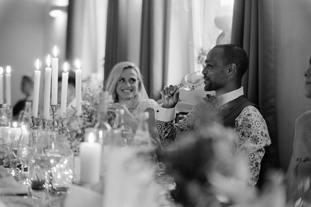The couple at the candlelit dinner table, black and white