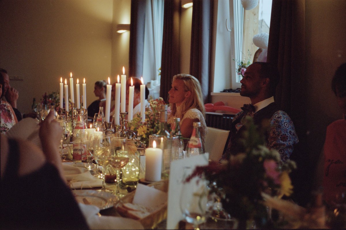 The long dinner table by candlelight