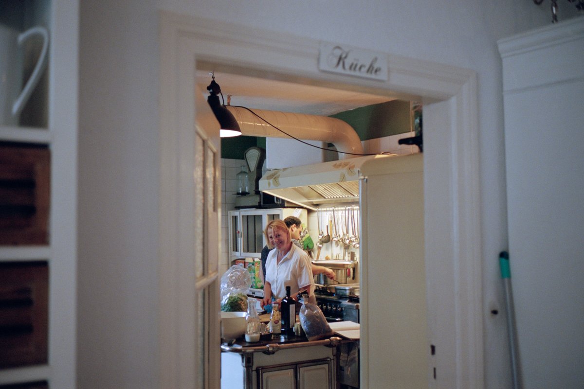 A glimpse through a doorway into the kitchen