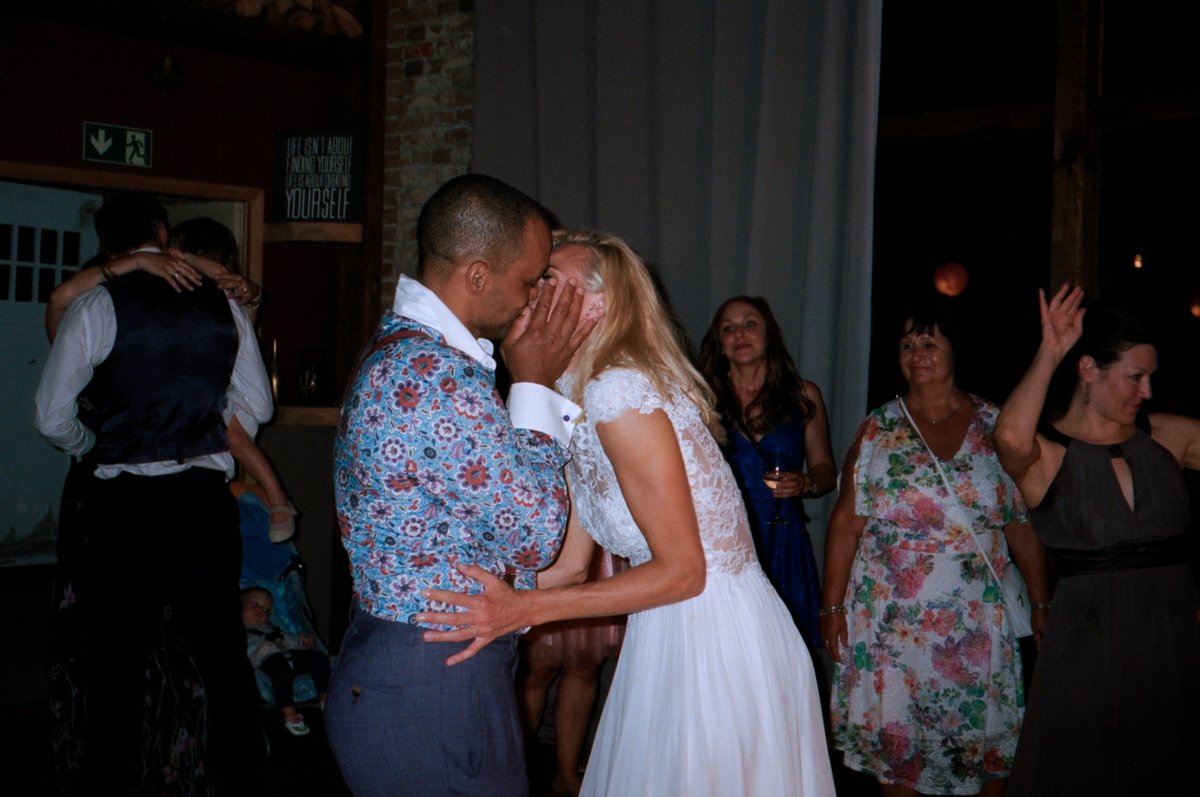 The couple dancing among their guests