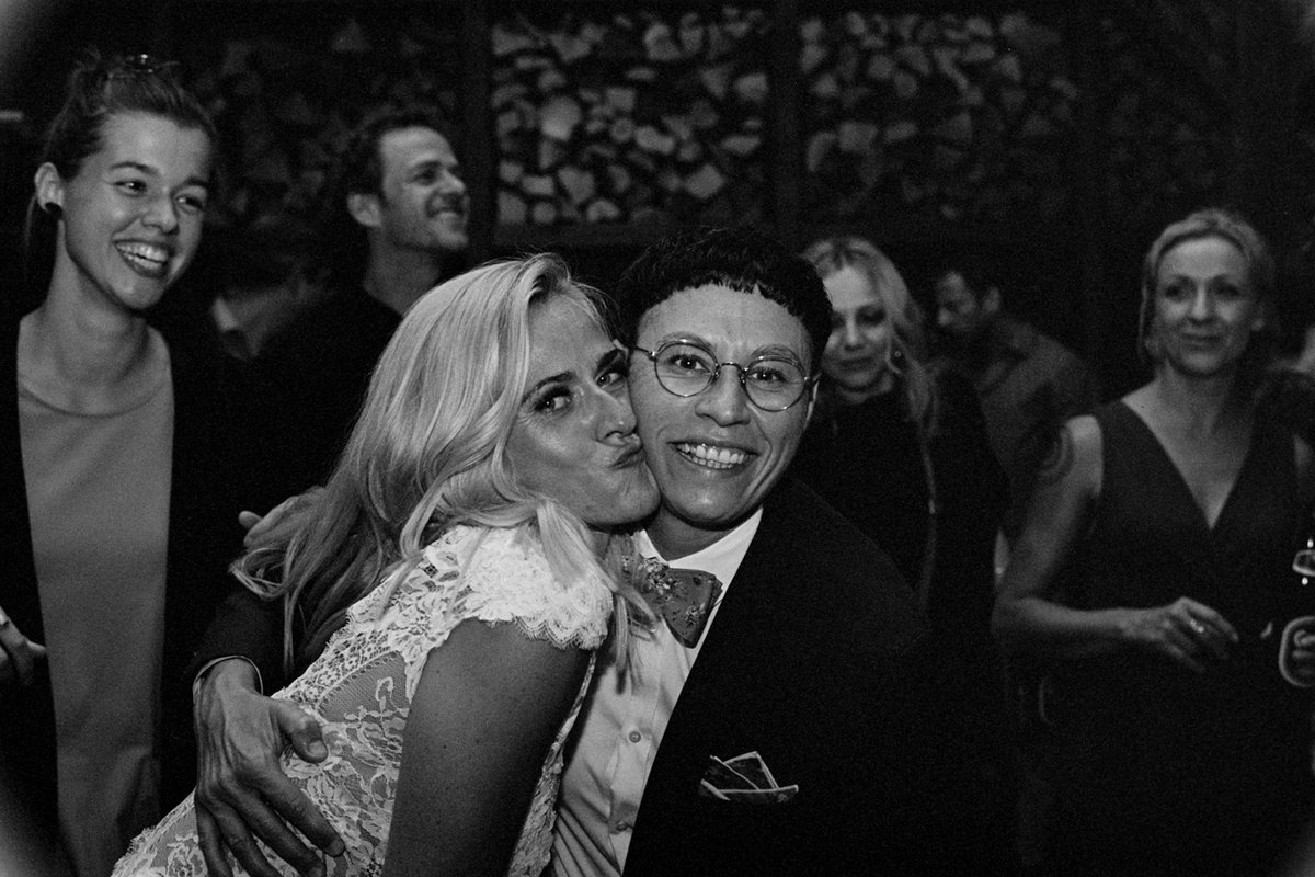 The bride with guests during the party, black and white
