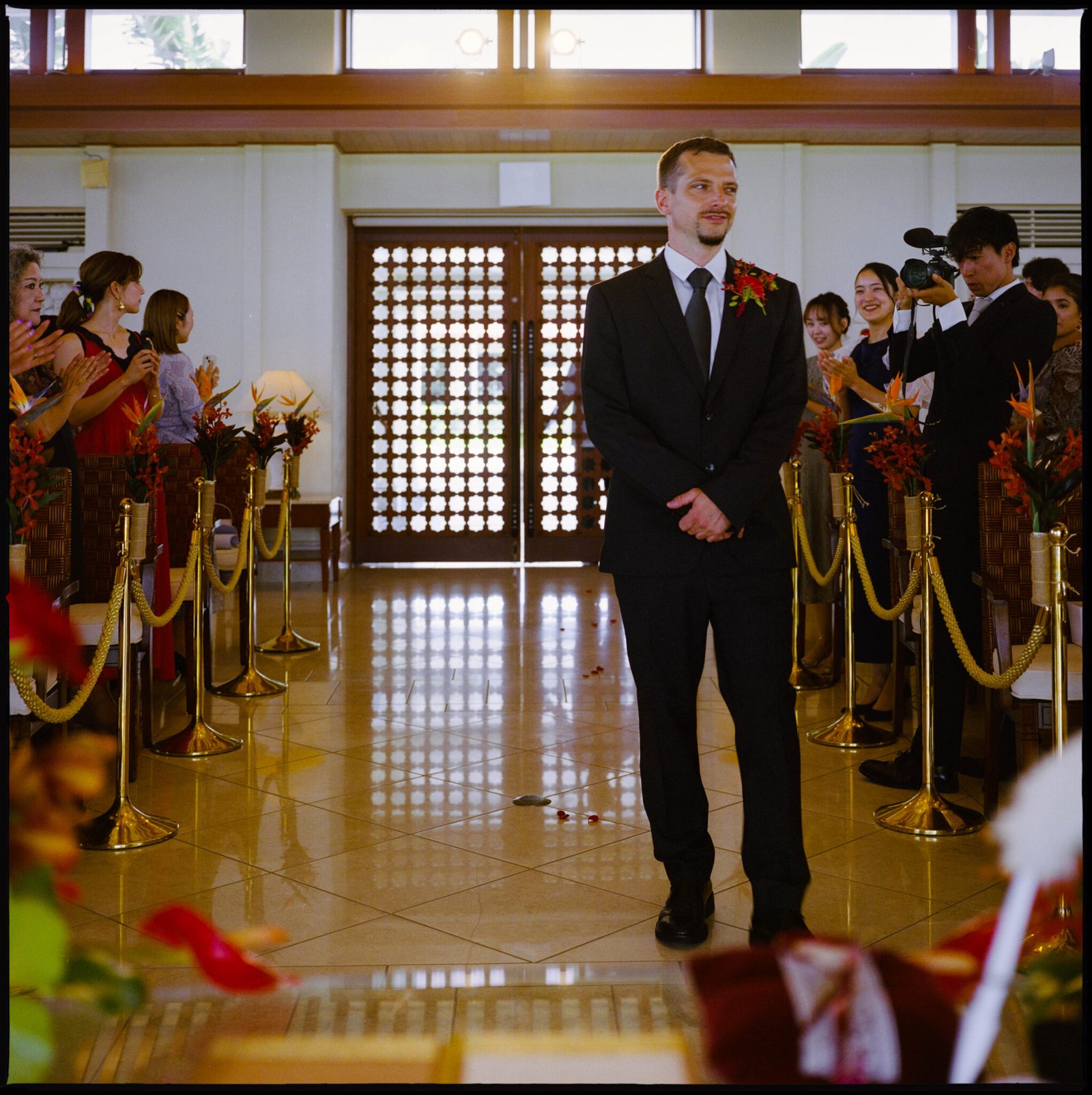 The groom waiting at the ceremony