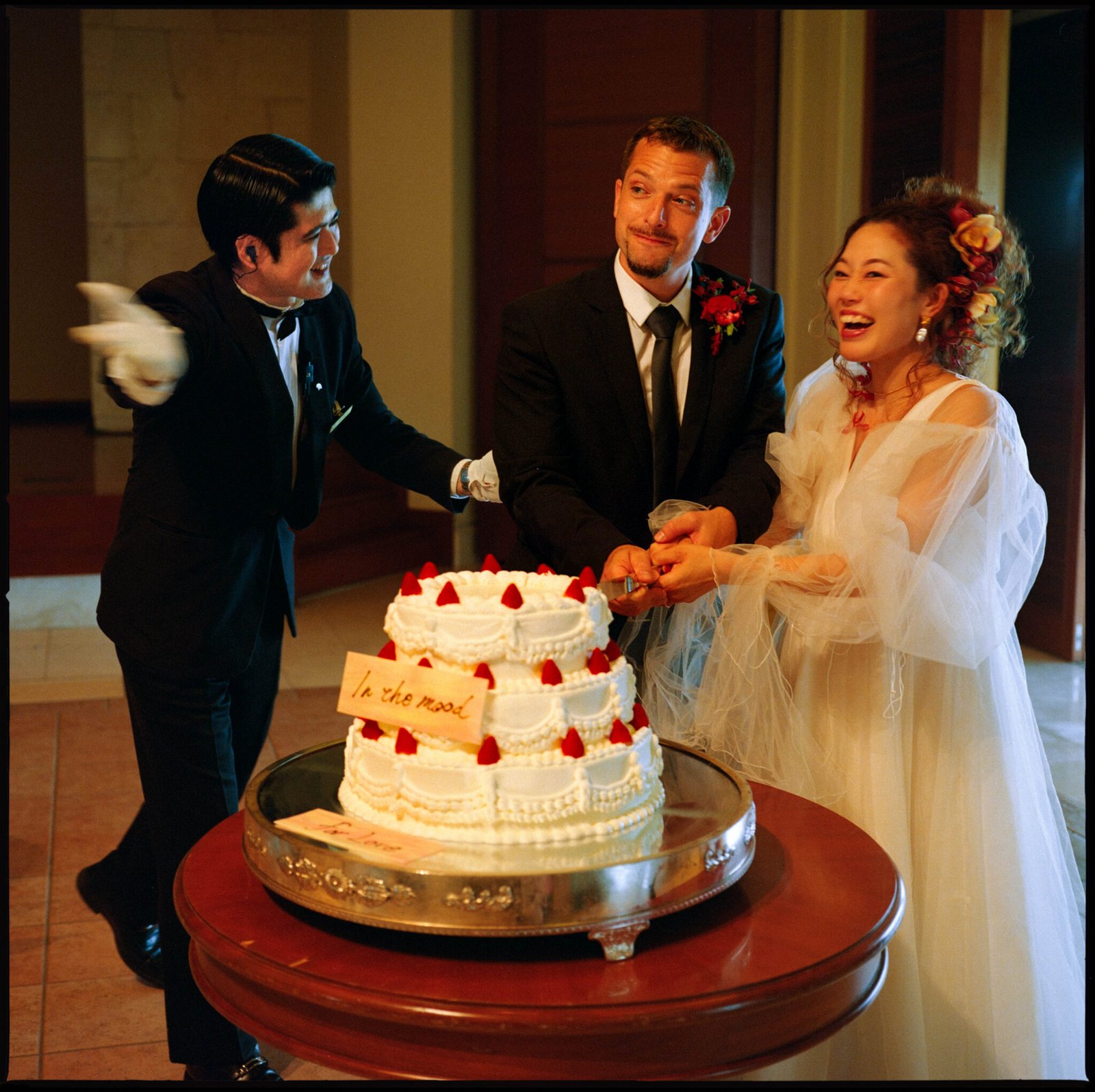 The couple cutting the wedding cake